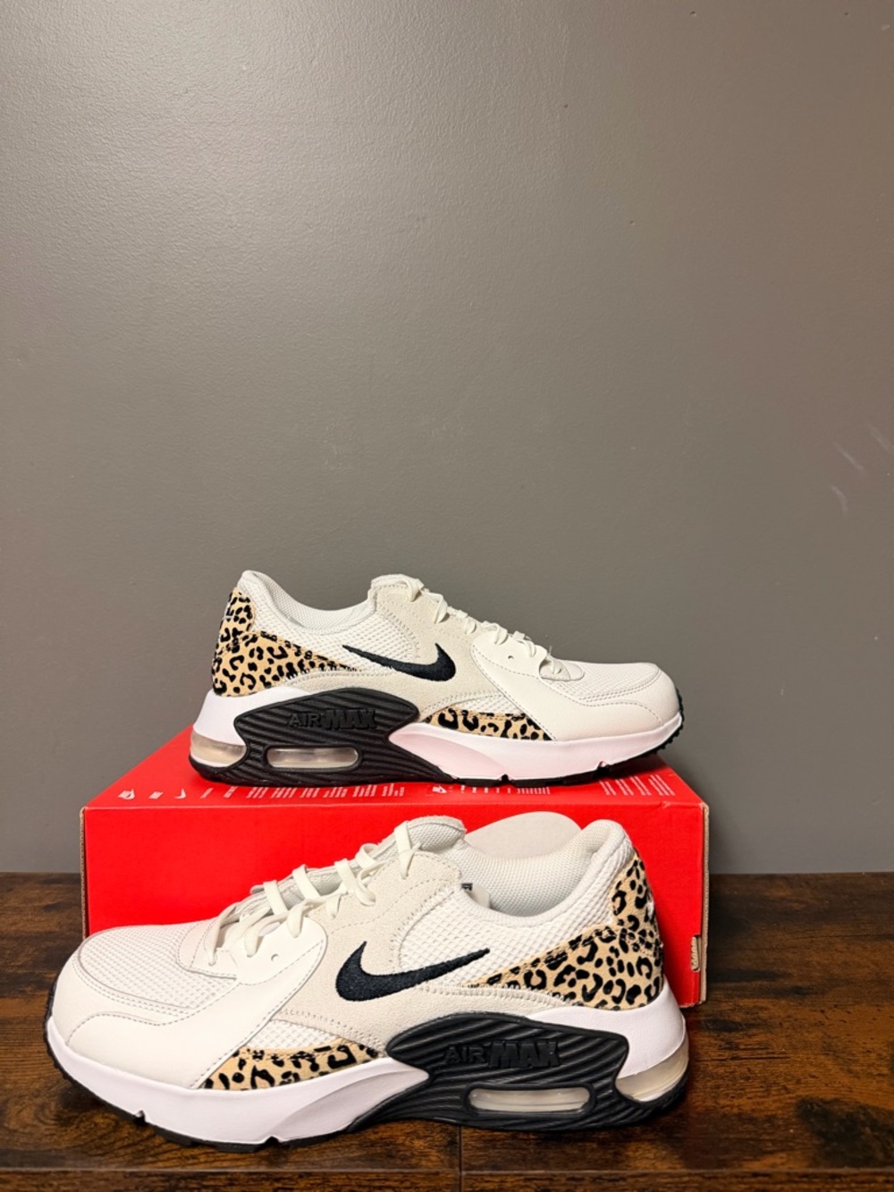 Nike Air Max Exclusive White Sneakers with Black Swoosh and Leopard Accents